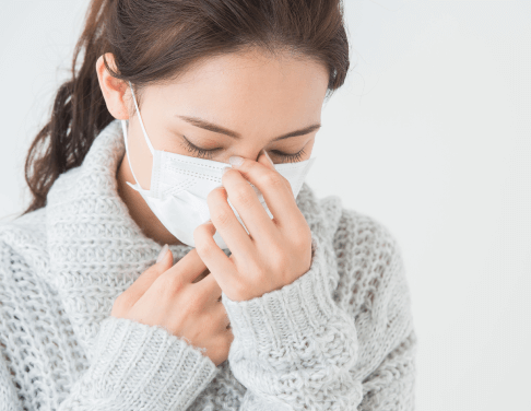 体調の優れない女性